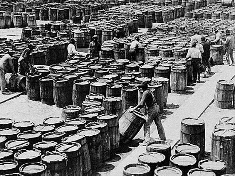Laborers on a Savannah dock prepare barrels of rosin for shipment, circa 1895. From the 1890s until 1945, the ports at Savannah and Brunswick shipped out most of the world's supply of naval stores. © Courtesy of Georgia Archives, Vanishing Georgia Collection