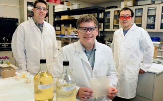 Dr. Dean Webster, North Dakota State University, Fargo, (center) and graduate students T.J. Nelson and Xiao Pan are among a research group that developed a family of resins from renewable raw materials. Photo credit: Dan Koeck, NDSU